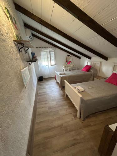 a room with two beds and a sink in it at Las Tres Patas Complejo Rural in Enix