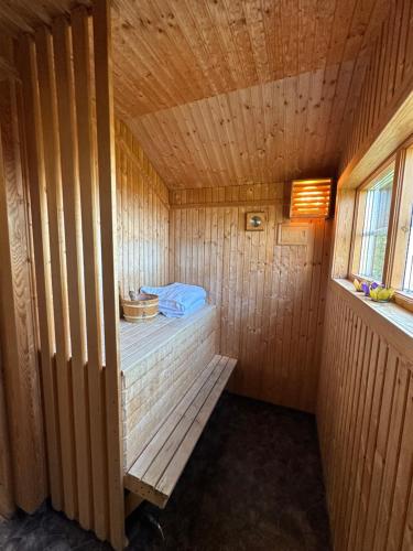 a wooden sauna with a bench in a room at Fryksås Hotell & Gestgifveri in Fryksås
