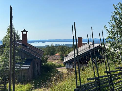 an old church with a cross on the roof at Fryksås Hotell & Gestgifveri in Fryksås
