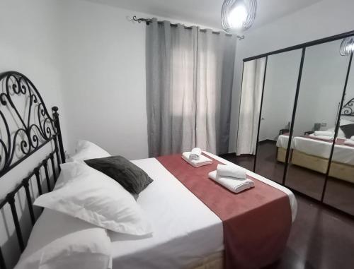 Postel nebo postele na pokoji v ubytování Palacio de Don Juan