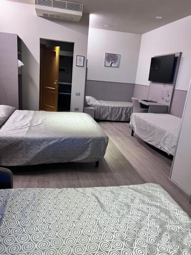 Hotel Baffo Rossoにあるベッド