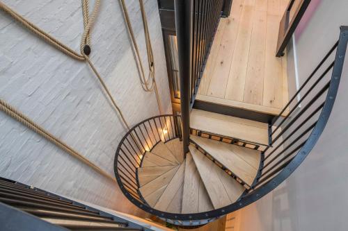 an overhead view of a spiral staircase in a building at The Acre Abode - Covent Garden - by Frankie in London
