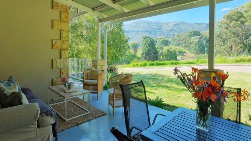 a living room with a couch and a table at Saints Rest in Clarens