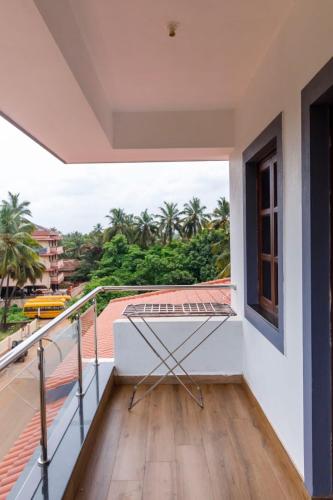 a balcony with a view of the ocean at Casa Quina in Panaji