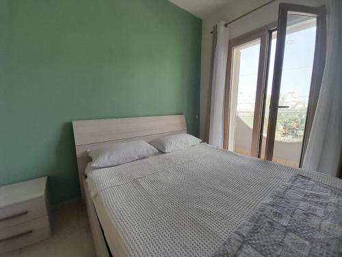 Ένα ή περισσότερα κρεβάτια σε δωμάτιο στο VILLA AMENDOLA BEACH