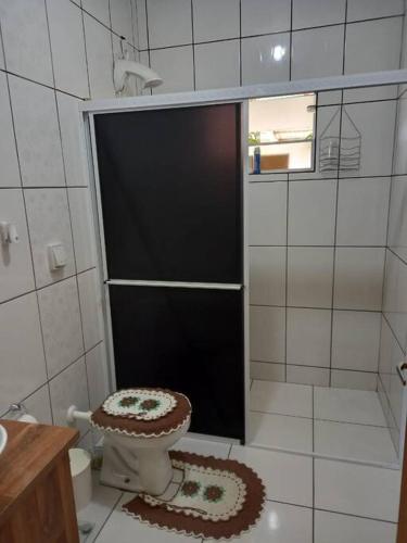 a bathroom with a shower with a toilet in it at Casa da Bela in Pomerode