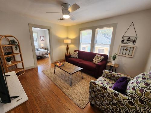 a living room with a couch and a table at Cute & Quiet Garage Apt Home in Houston