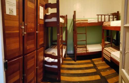 Una cama o camas en una habitación de Antonieta Hostel e Bistro