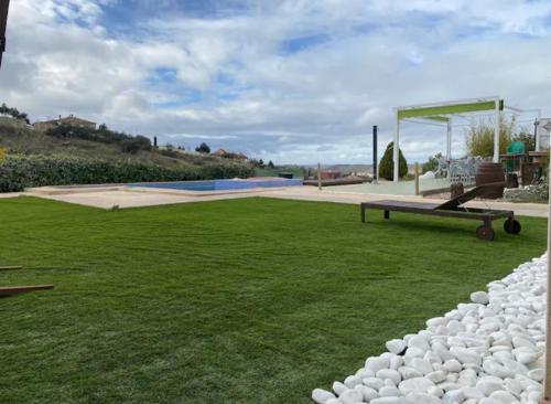 a park with a bench and a gazebo at Villa Galiana By Florentia Homes in Toledo