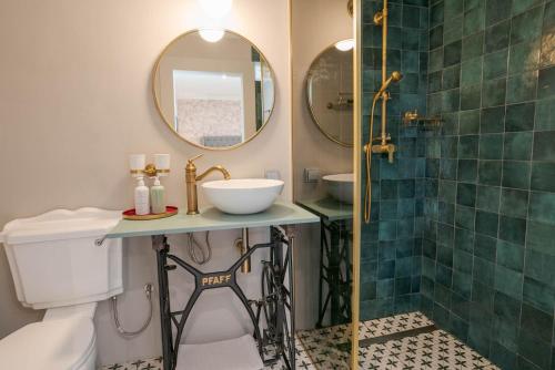 a bathroom with a toilet and a sink and a shower at VILLA OXA - Boutique Design Hotel in Maria Alm am Steinernen Meer