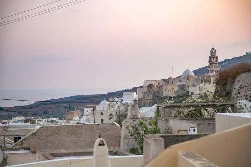 a view of a city from the roof of a building at Elite Houses Santorini in Emporio