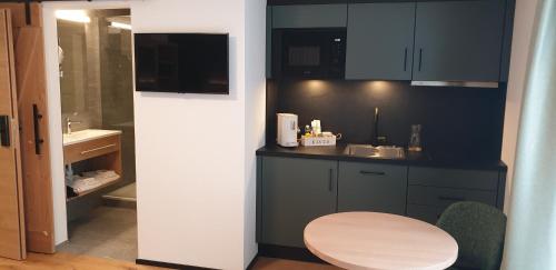 Kuchyň nebo kuchyňský kout v ubytování Appart Hotel Pitschonia Self Check-In
