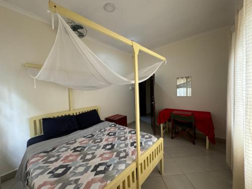 Кровать или кровати в номере JACARANDA HOMESTAY