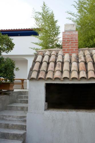 a roof of a house with a brick chimney at LavandinaLuxe APP in Novi Vinodolski