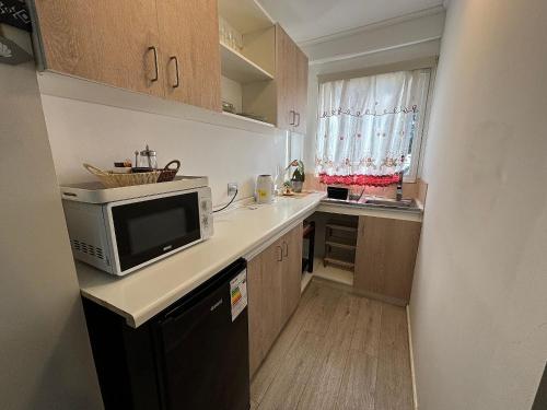 Dapur atau dapur kecil di Rbkº Acogedora y Rústica en Laguna Verde, Cabaña 4