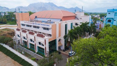 an overhead view of a white building with a red roof at HOTEL UDUPI INTERNATIONAL in Nāgercoil