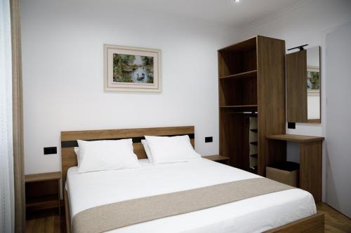 Postel nebo postele na pokoji v ubytování Bliss Hotel