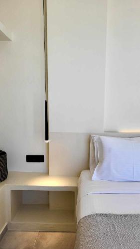 Un ou plusieurs lits dans un hébergement de l'établissement Maeva Suites Santorini
