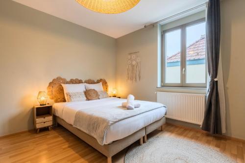 Postel nebo postele na pokoji v ubytování Bright 1 bedroom apartment, close to city center