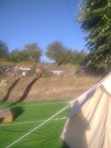 a view of a tennis court from a window at Avantura Kamp in Jošanica