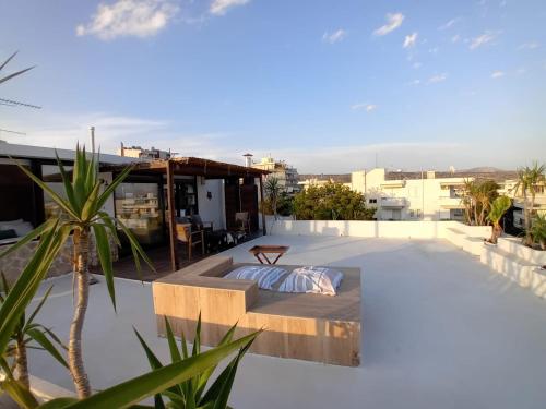 a bedroom on the roof of a house at Luxury Penthouse Suite in Vari
