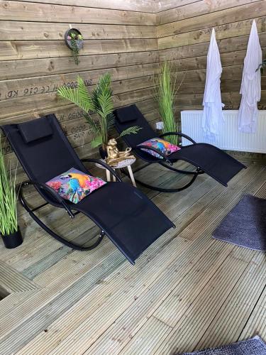 a group of chairs sitting on a patio at Mount Eagle - Sleeps 24 in Limerick