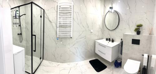 Ванная комната в Apartament nad jeziorem Magistrackim w Mrągowie