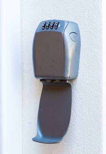 a blue object is hanging on a wall at Studio 1 - Appart'hôtel avec terrasse, CLIM, WIFI - TU ELLETA in Tulette