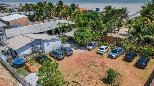 an aerial view of cars parked in a parking lot at Hotel Terra e Mar - Crispim PA in Marapanim