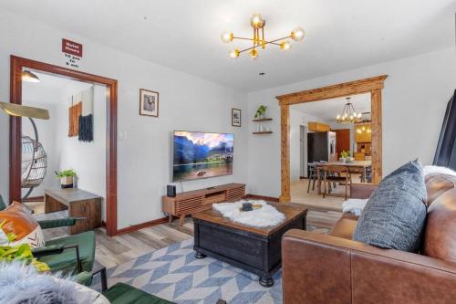 a living room with a couch and a table at Renovated 6BR 2BA AC home and Game Room in Atlantic City