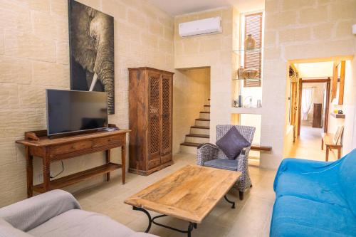 Μια τηλεόραση ή/και κέντρο ψυχαγωγίας στο Tranquil 2-Bedroom Escape