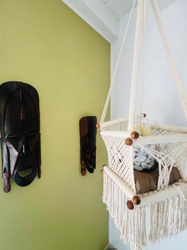 a room with a helmet hanging on a green wall at B&B Rifugio Degli Artisti - Themed Rooms in Monzambano