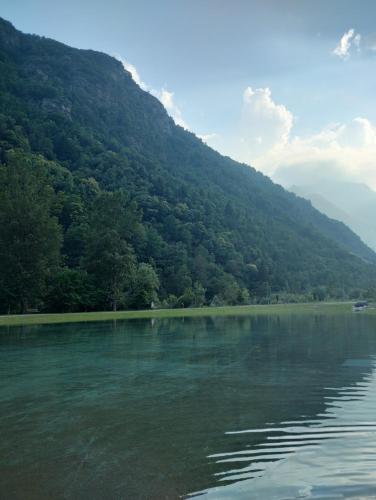 a body of water with a mountain in the background at Vinadio Sole & Relax in Vinadio