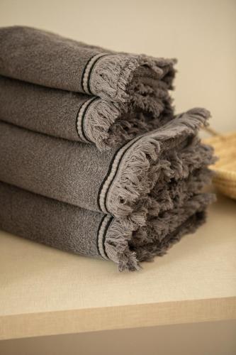 a pile of towels sitting on top of a counter at San Borja Boutique 2 in Gandía