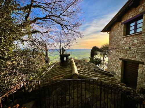 a stone stairway leading up to a house at Le Mandrie Di San Paolo in Assisi