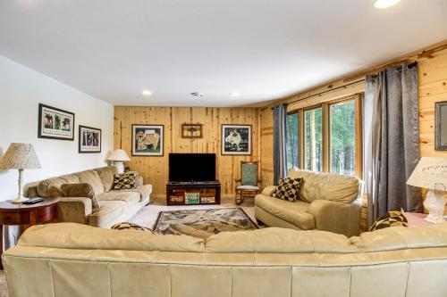 a living room with two couches and a tv at Idyllic Remer Cabin with On-Site Lake Access! in Remer