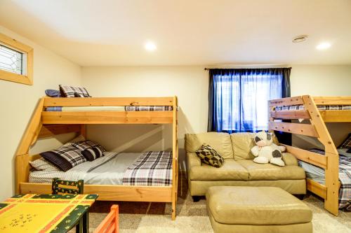 a bedroom with two bunk beds and a couch at Idyllic Remer Cabin with On-Site Lake Access! in Remer