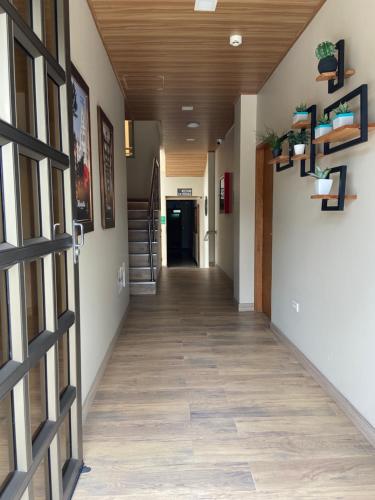a hallway of a building with a hallway at Hotel Campo Real in Rionegro