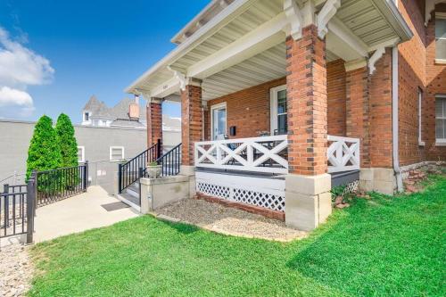 a brick house with a porch with a gate at The Big House in Jefferson City
