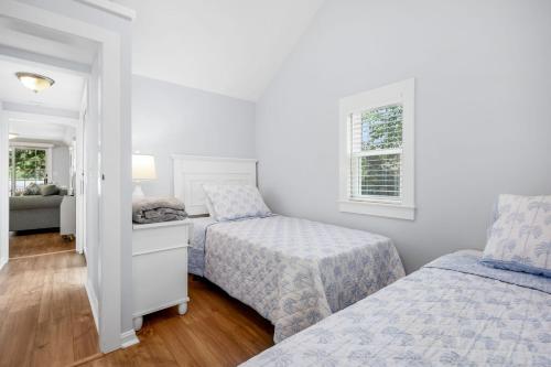 a bedroom with two beds and a window at 251 Old Wharf Road Unit 163 Dennis Port - Hilltop Hideaway in Dennis Port