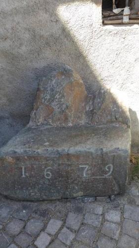 an old stone object on the side of a building at Historische Maisonettewohnung bis 10 Gäste, Magic Pass Belalp, Rosswald und mehr in Naters
