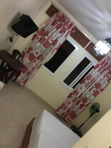a view of a kitchen with a room with a window at Dar Bouanani in Asilah
