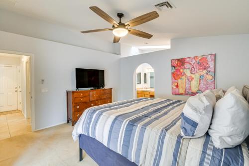 a bedroom with a bed and a ceiling fan at Lake Havasu Home - 2 Mi from Main Launch Ramp! in Lake Havasu City