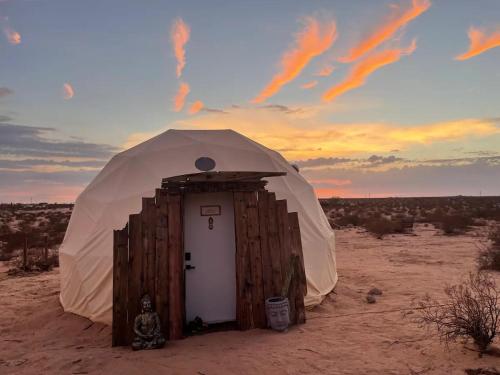 a dome tent in the middle of the desert at Geodesic Dome for Glamping in Sunfair Heights