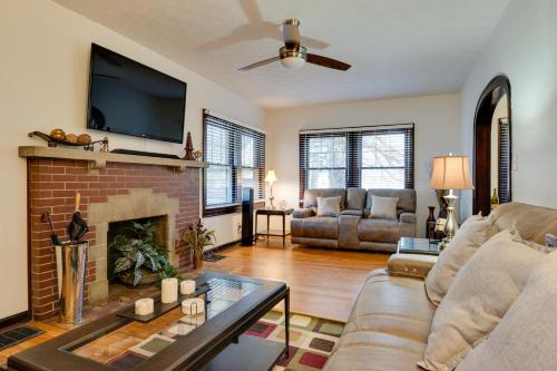 a living room with a couch and a fireplace at Idyllic Home Near Lucas Oil Stadium and Dtwn Indy! in Indianapolis