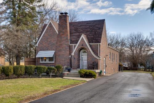 a red brick house with a driveway at Idyllic Home Near Lucas Oil Stadium and Dtwn Indy! in Indianapolis