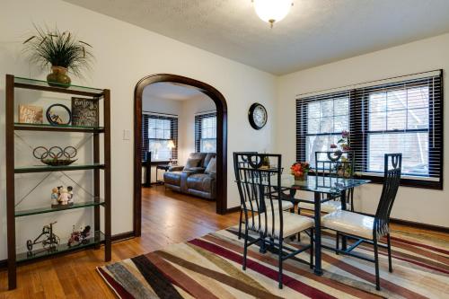 a dining room with a glass table and chairs at Idyllic Home Near Lucas Oil Stadium and Dtwn Indy! in Indianapolis