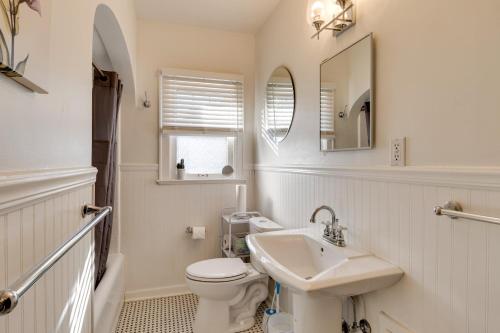 a white bathroom with a sink and a toilet at Idyllic Home Near Lucas Oil Stadium and Dtwn Indy! in Indianapolis