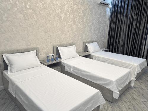 TownHouse Near To Tashkent Terminal 3にあるベッド