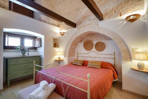 A bed or beds in a room at Dimora Monte Grappa